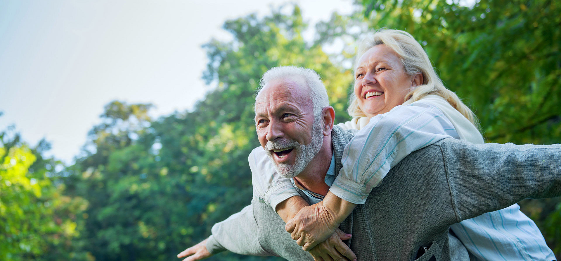 senior and his wife playing outside