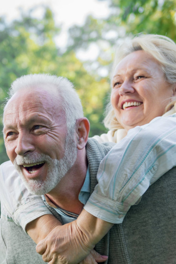 senior and his wife playing outside